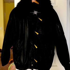 Woman’s black leather jacket zip enclosure fur collar